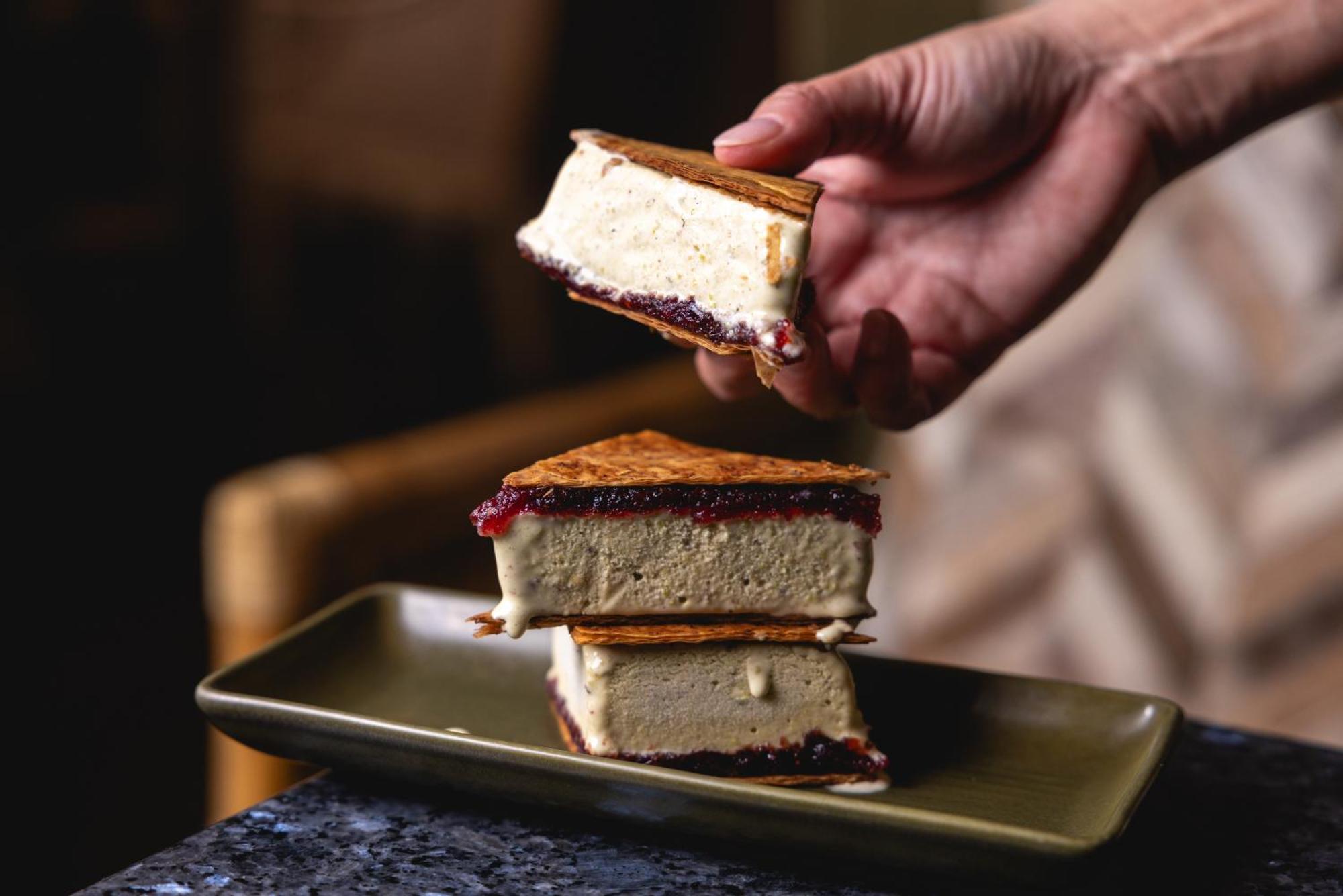 Ovolo The Valley Brisbane Ngoại thất bức ảnh A hand holding a piece of ice cream sandwich